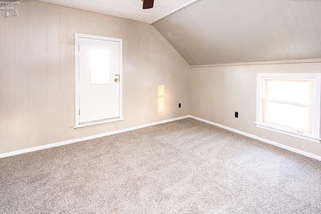 bonus room featuring lofted ceiling, ceiling fan, and carpet flooring