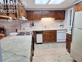 kitchen with sink and white appliances