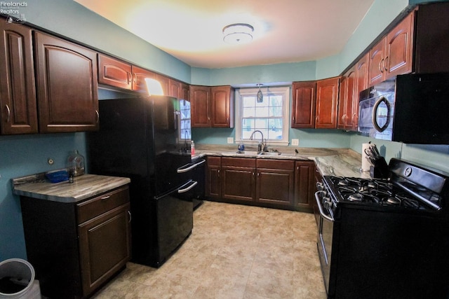 kitchen with sink and black appliances