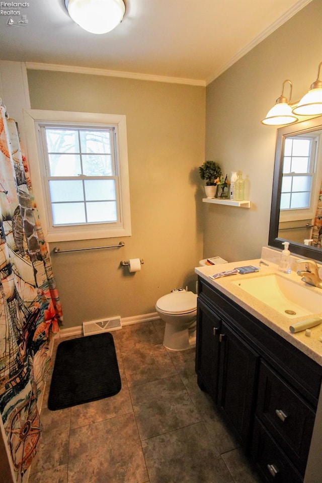 bathroom featuring toilet, crown molding, and vanity