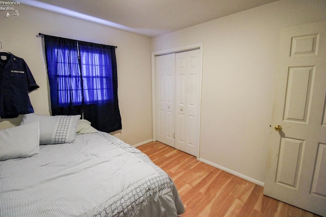 bedroom featuring a closet and hardwood / wood-style flooring