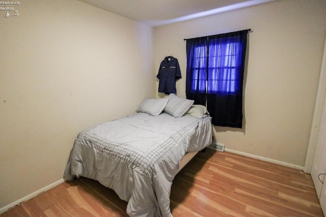 bedroom featuring hardwood / wood-style floors