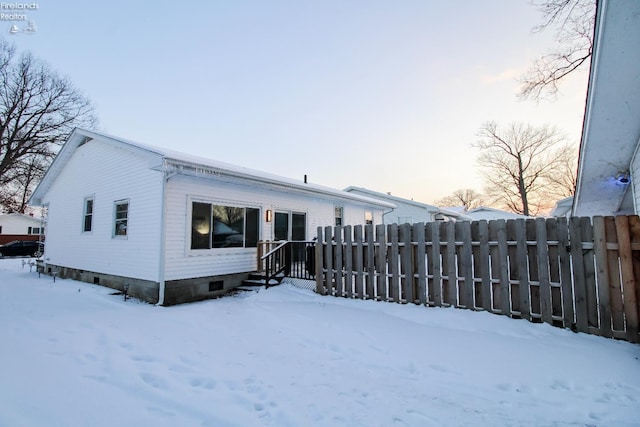 view of snow covered house