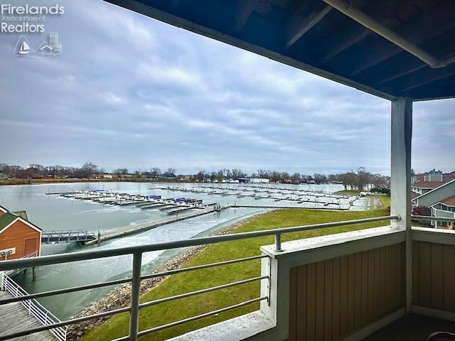 balcony featuring a water view