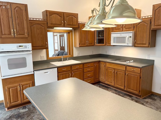 kitchen featuring white appliances and sink