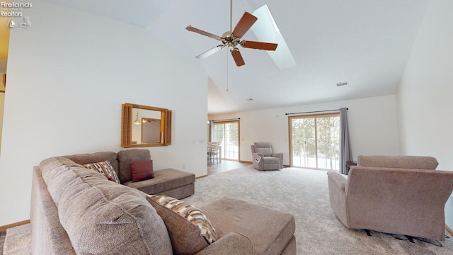 living room featuring high vaulted ceiling, ceiling fan, and light colored carpet