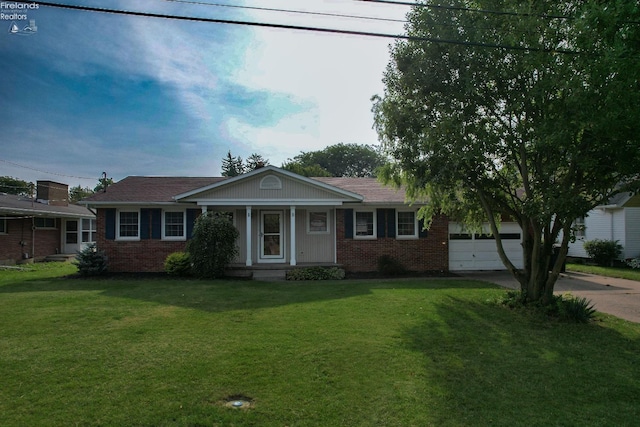 single story home with a garage and a front lawn