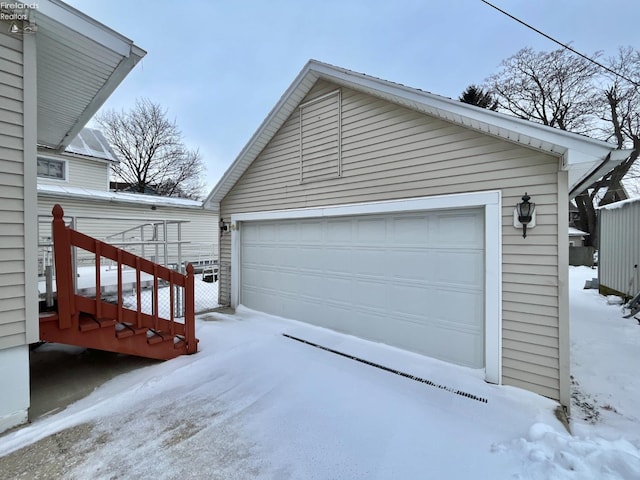 view of snow covered garage