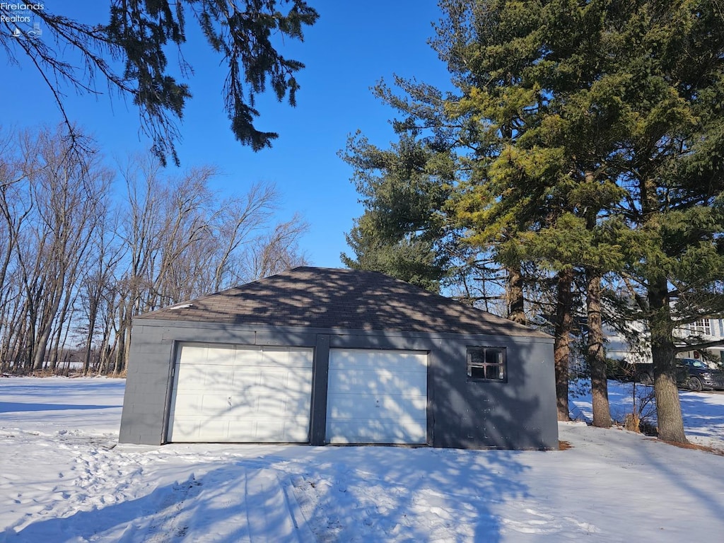 view of snow covered garage