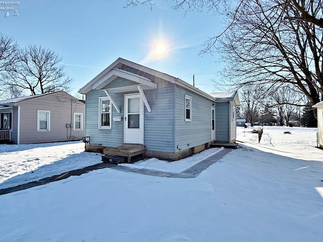 view of snow covered house