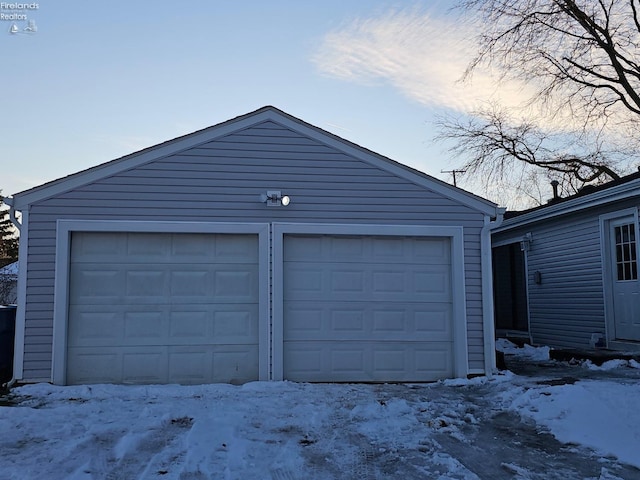 view of snow covered garage