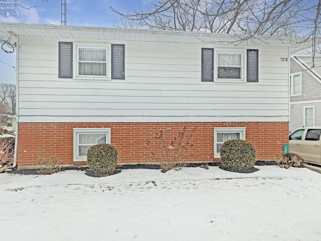 view of snow covered property