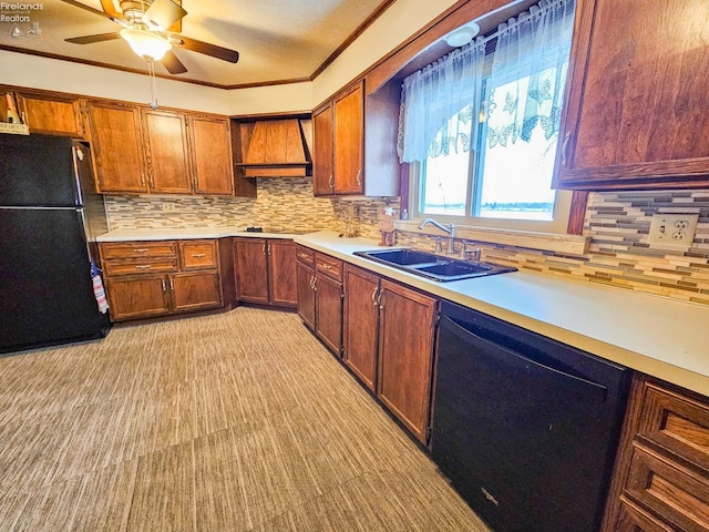 kitchen with backsplash, black appliances, sink, ornamental molding, and custom range hood