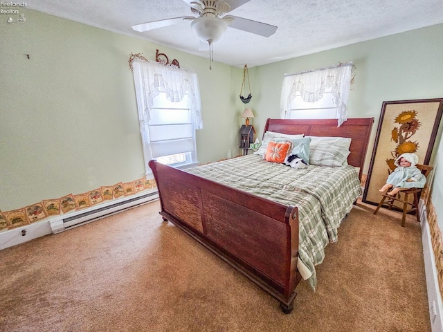 carpeted bedroom featuring ceiling fan, baseboard heating, and a textured ceiling