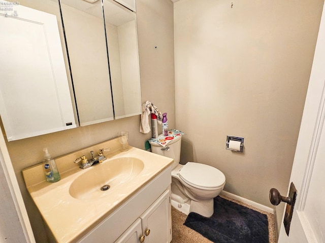 bathroom with toilet and vanity