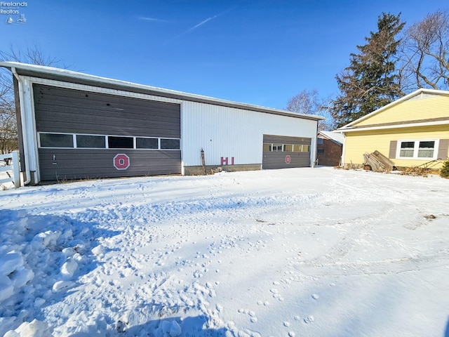 view of snow covered garage