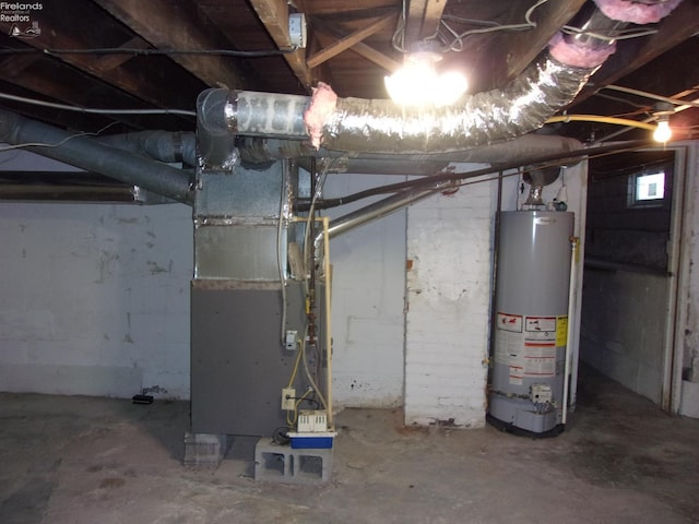 basement featuring heating unit and gas water heater