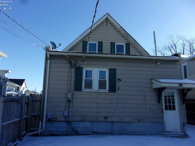 view of side of home with a patio area