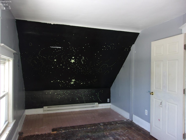 room details featuring baseboard heating and hardwood / wood-style flooring