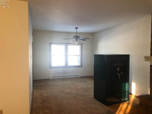 unfurnished dining area with ceiling fan and baseboard heating