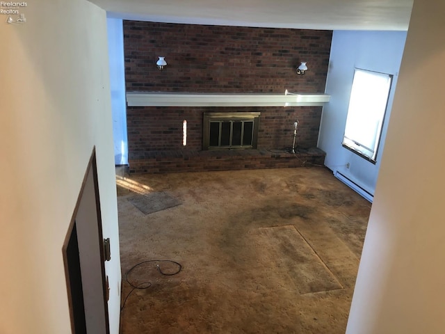 unfurnished living room with a baseboard heating unit and a fireplace