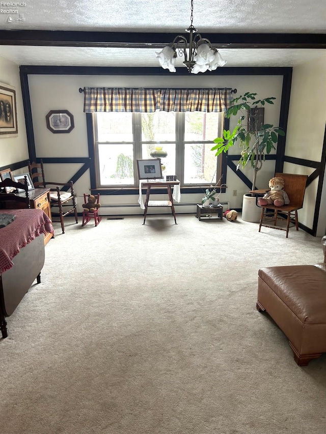 living room featuring a textured ceiling, carpet flooring, a chandelier, and beamed ceiling