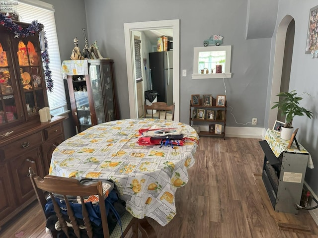 dining area featuring dark hardwood / wood-style flooring