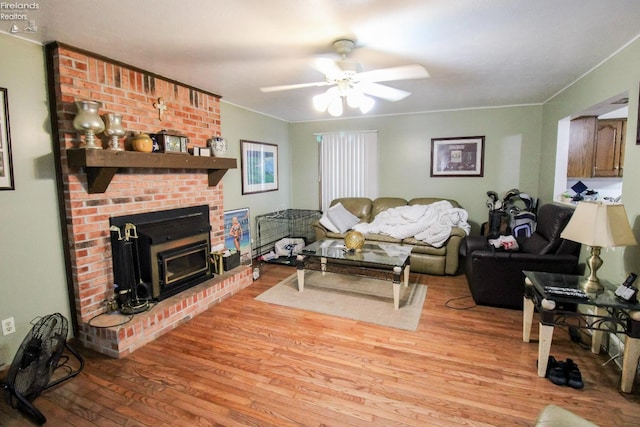 living room with light wood-type flooring and ceiling fan