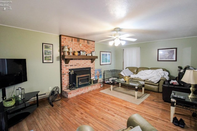 living room featuring ceiling fan and hardwood / wood-style floors