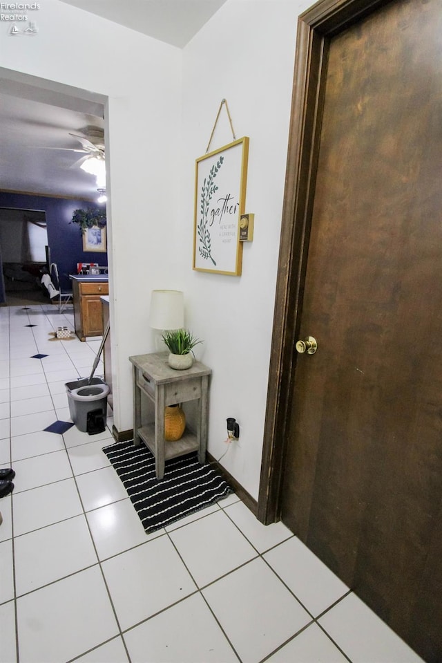 hallway featuring light tile patterned floors