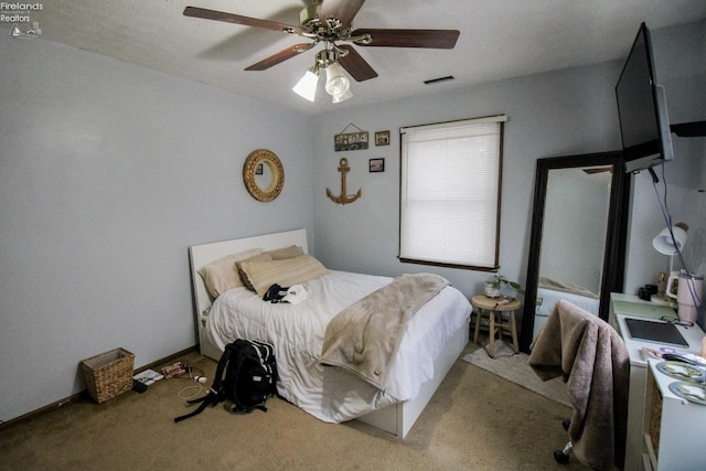 carpeted bedroom with ceiling fan