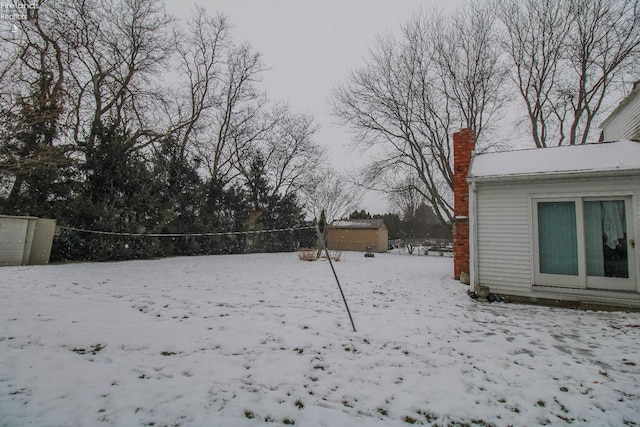 view of yard covered in snow