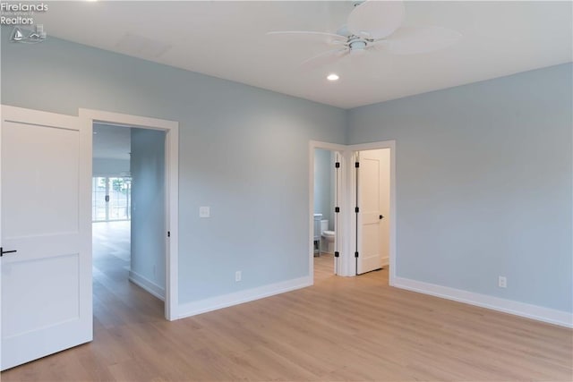 unfurnished room featuring ceiling fan and light hardwood / wood-style floors