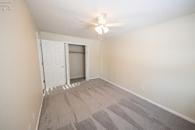 unfurnished bedroom with a closet, carpet floors, and ceiling fan