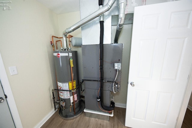 utility room featuring gas water heater