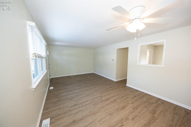 unfurnished room featuring ceiling fan and hardwood / wood-style floors