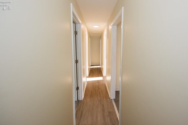 hall with light hardwood / wood-style floors