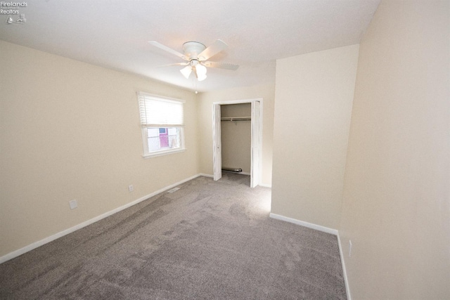 unfurnished bedroom with ceiling fan, a closet, and carpet floors