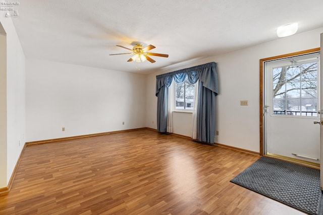 foyer featuring ceiling fan and light wood-type flooring