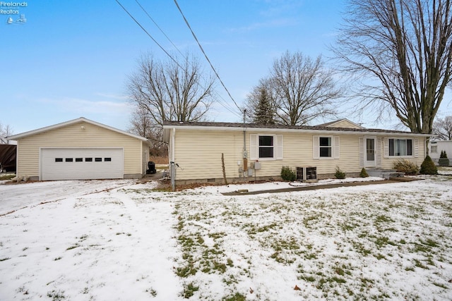 ranch-style home with central AC and a garage