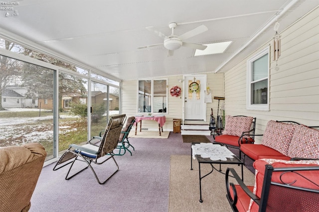 sunroom featuring ceiling fan