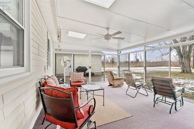 sunroom / solarium with ceiling fan