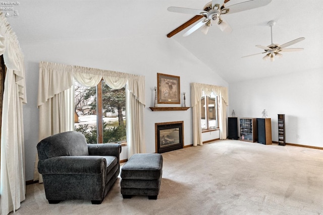 living area with high vaulted ceiling, light colored carpet, ceiling fan, and beamed ceiling