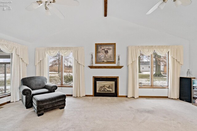 sitting room with high vaulted ceiling, carpet, and beamed ceiling