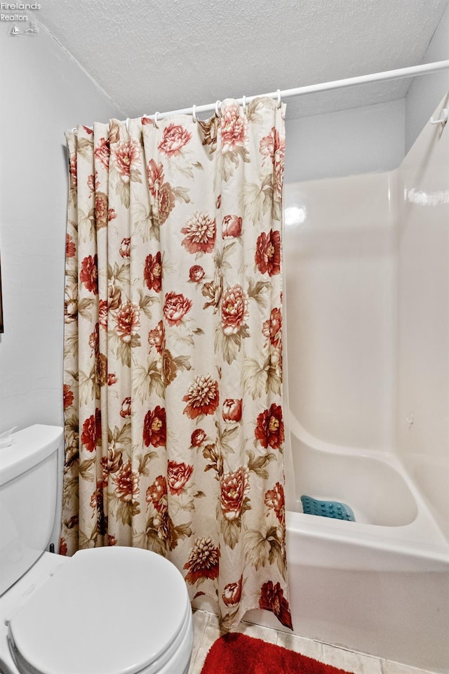 bathroom with toilet, shower / bath combination with curtain, and a textured ceiling