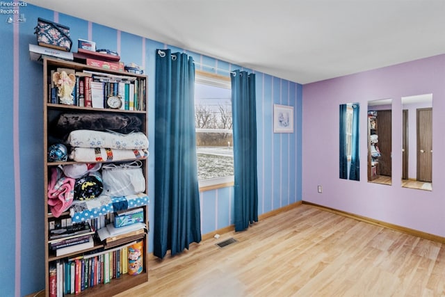 empty room with wood-type flooring