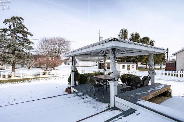 snow covered deck with an outdoor structure