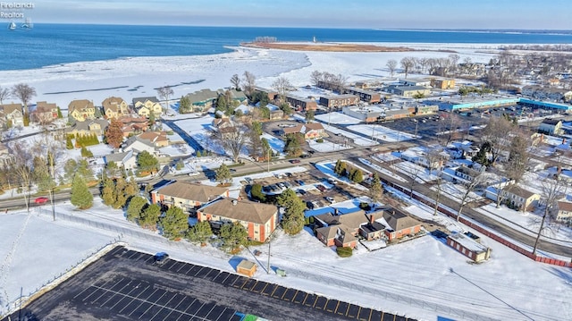 bird's eye view with a water view and a view of the beach