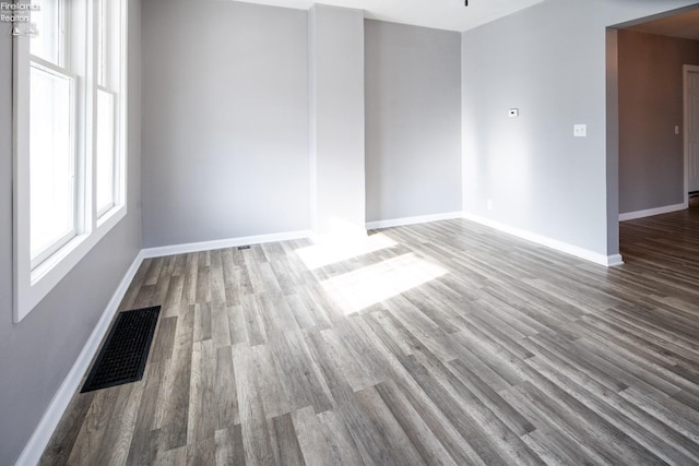 unfurnished room featuring hardwood / wood-style flooring