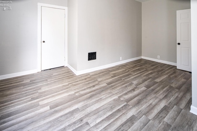 unfurnished room featuring light hardwood / wood-style flooring